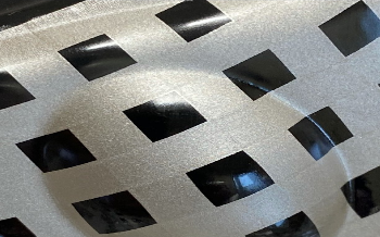 Thermoformable in-mold compatible electrically conductive ink.
